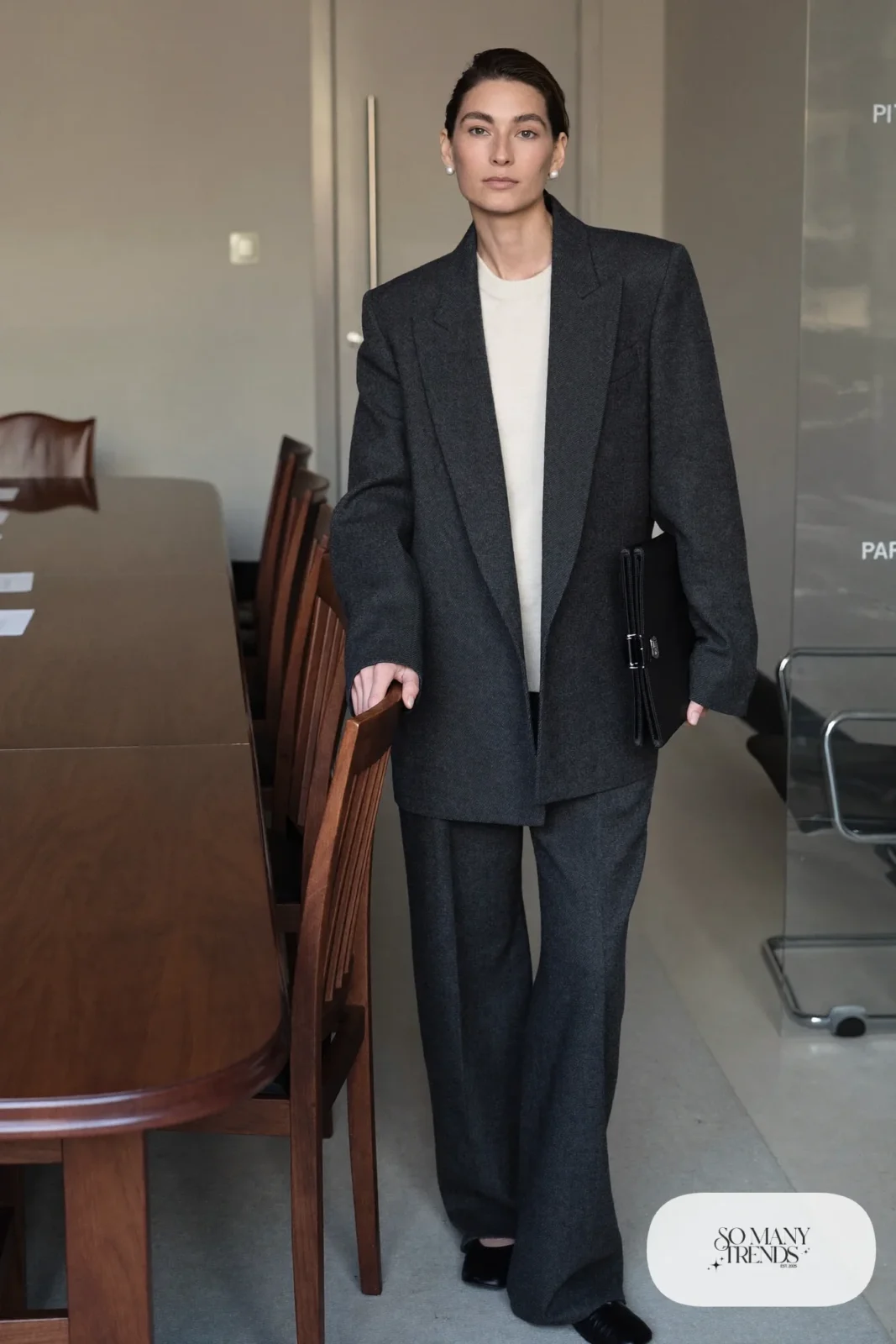 oversized charcoal blazer, matching wide-leg pants, cream fine knit sweater, pearl studs, black pointed flats, outfit 9