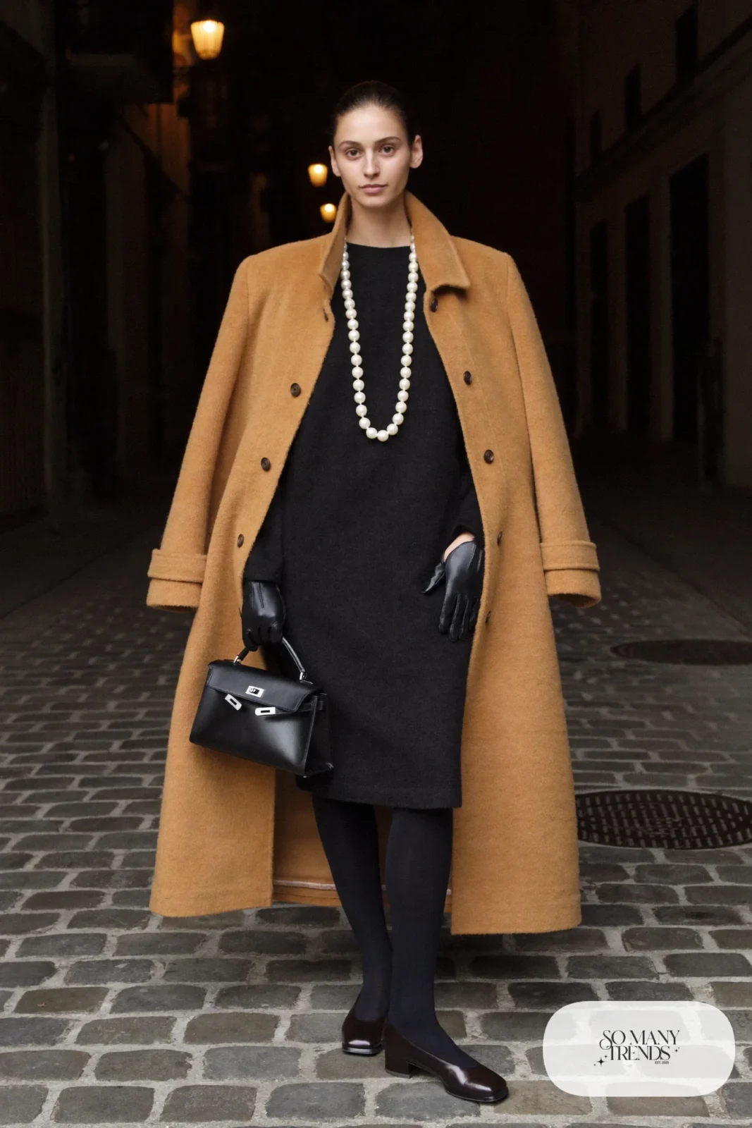 black wool long-sleeve midi dress, oversized camel coat, long pearl strand, sheer tights, black closed-toe pumps, outfit 33