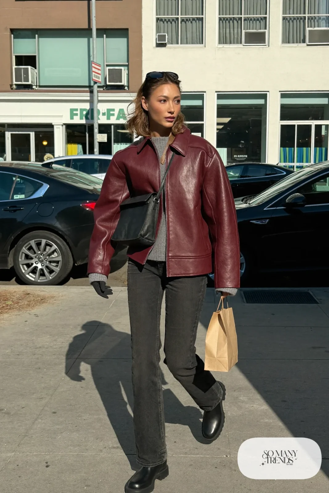 burgundy boxy leather jacket black straight jeans gray knit sweater black lug-sole boots crossbody bag outfit 12
