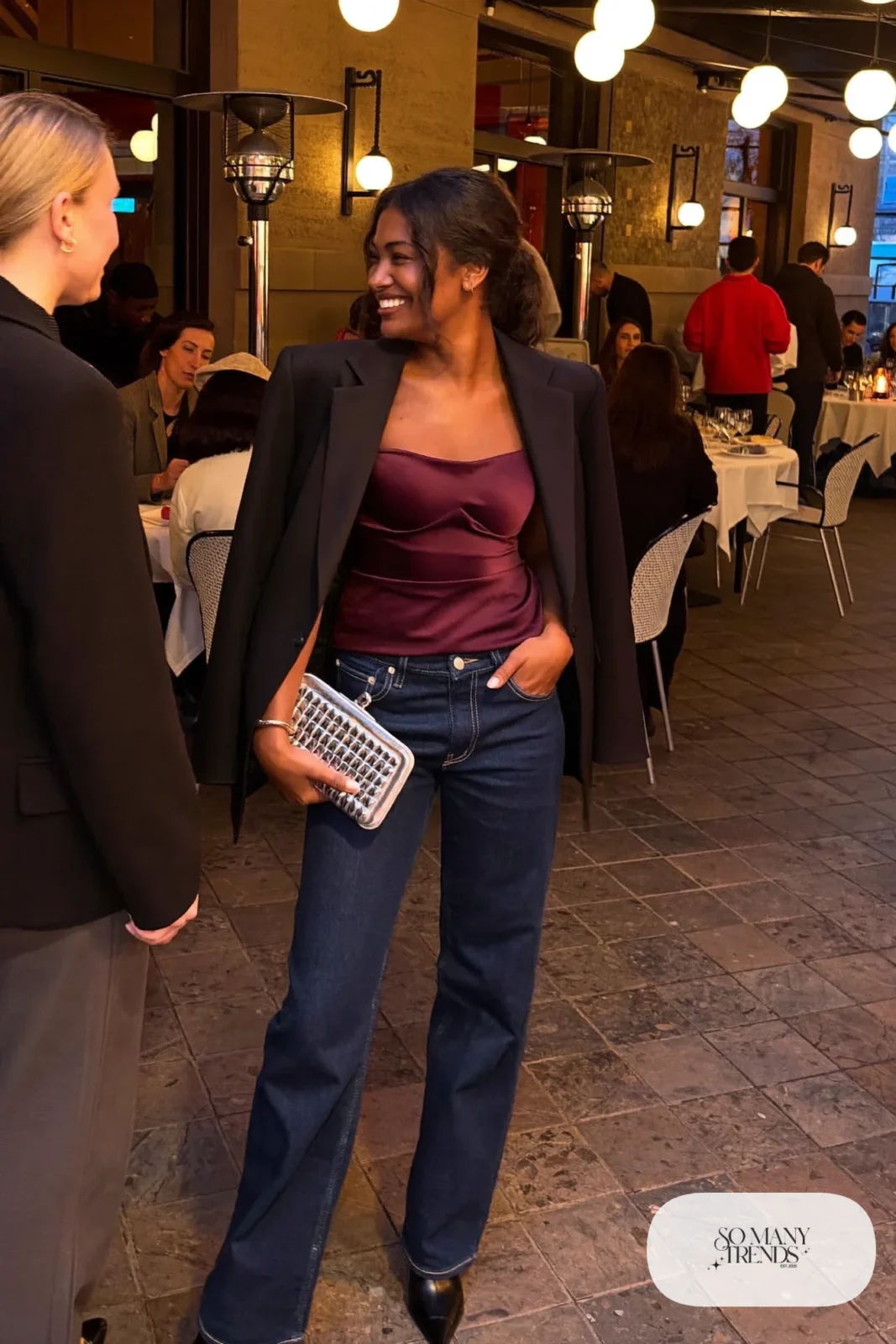burgundy structured bodice top dark straight jeans oversized black blazer pointed boots metallic clutch outfit 19