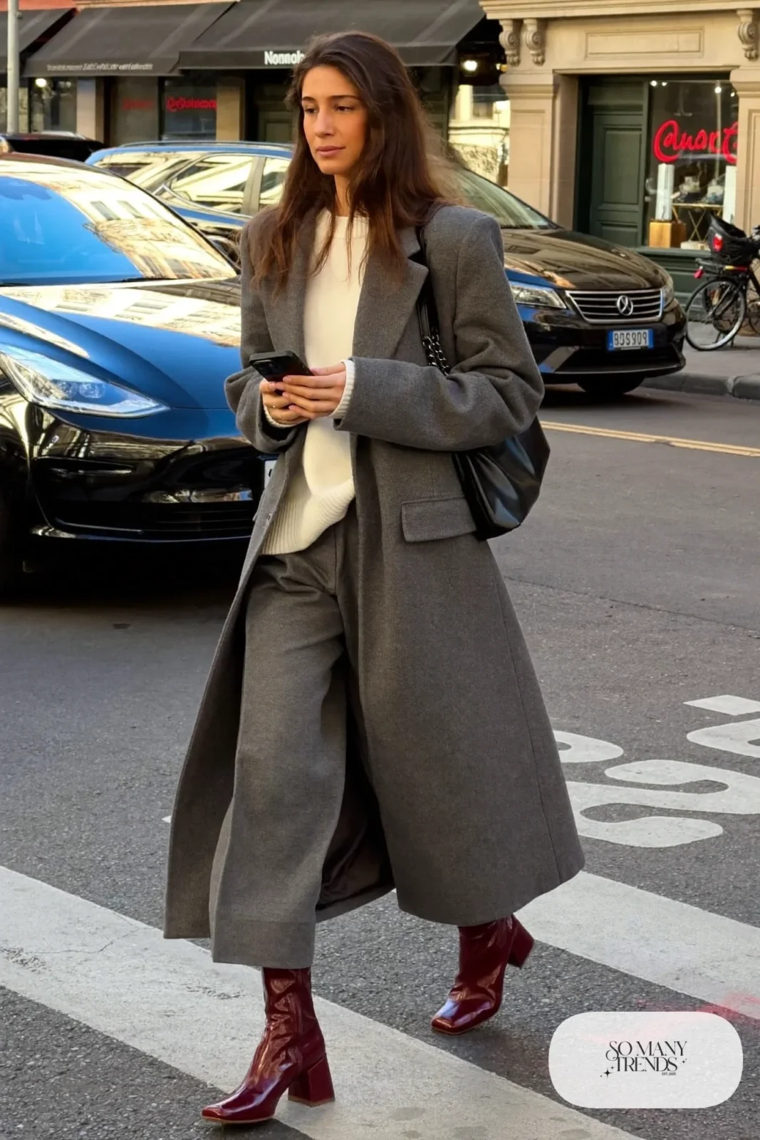 burgundy leather block-heel boots gray wide-leg pants cream sweater long gray coat black bag outfit 27