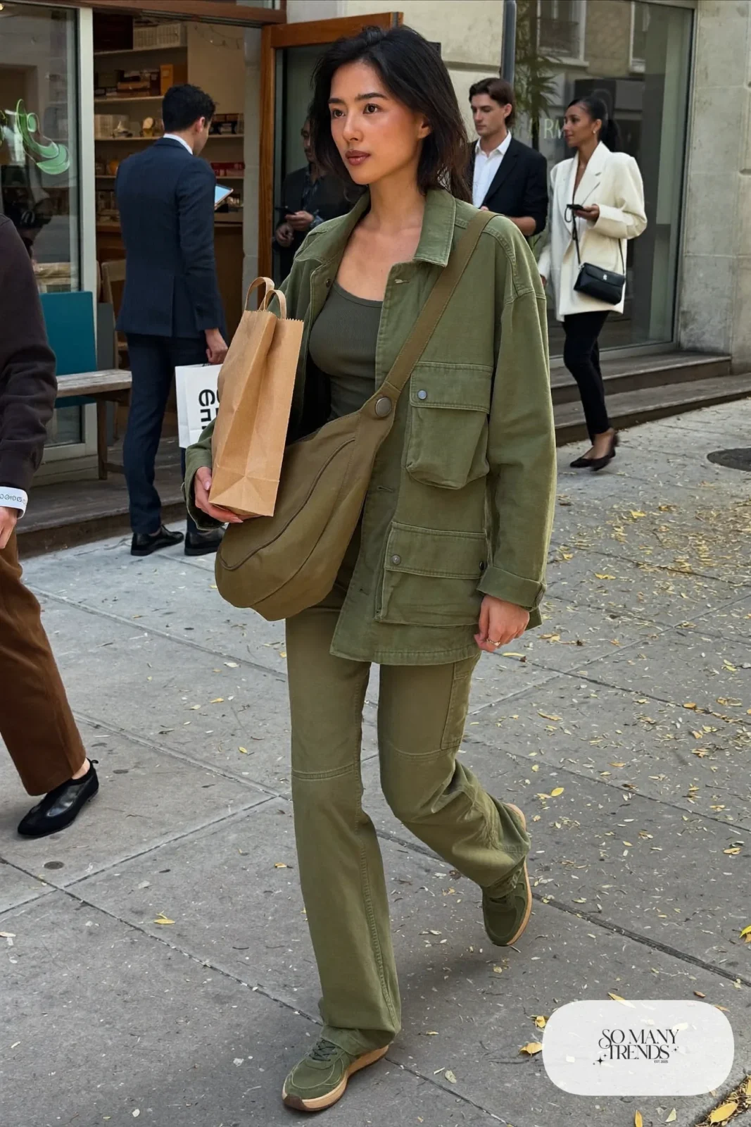 woman in olive utility jacket, cargo pants, ribbed tank and suede sneakers outfit 2