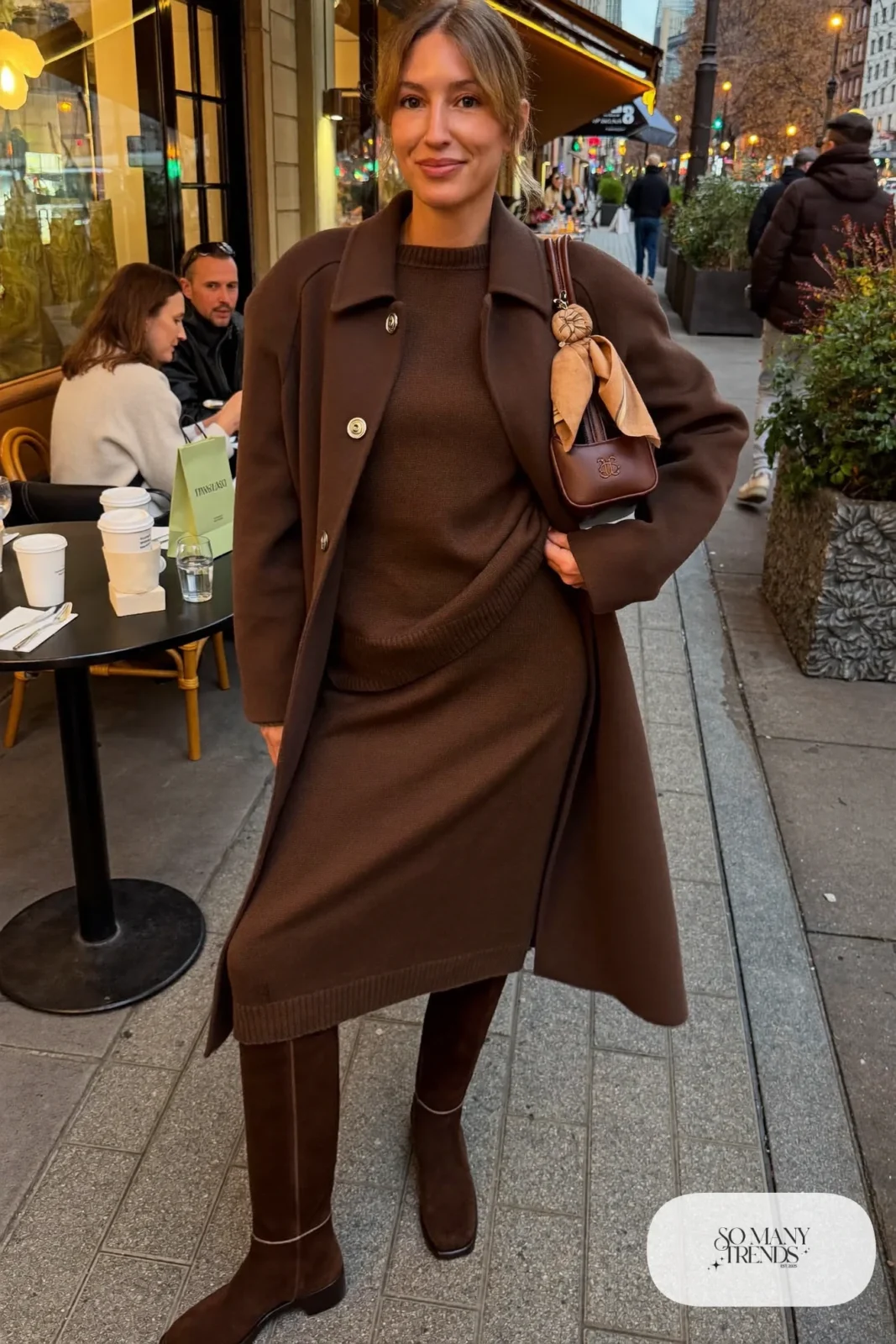 woman in chocolate brown knit midi dress, long wool coat and knee-high suede boots outfit 3
