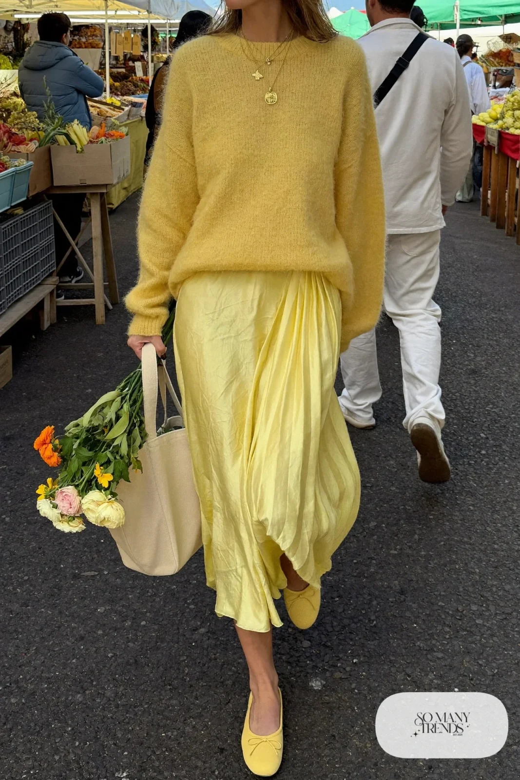 woman in butter yellow sweater, long pleated skirt and ballet flats outfit 5