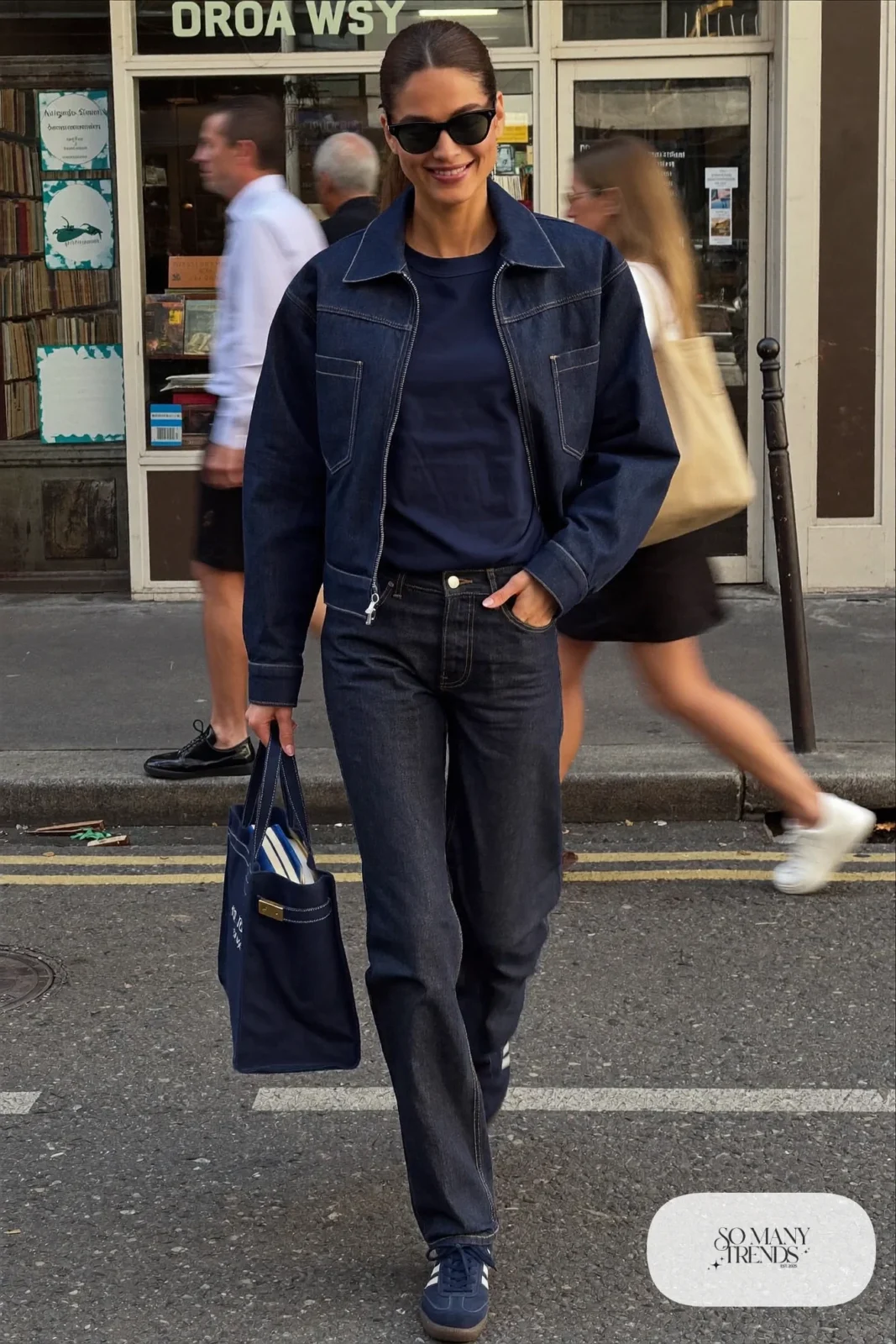 woman in dark indigo denim jacket, straight jeans, navy tee and sneakers outfit 8