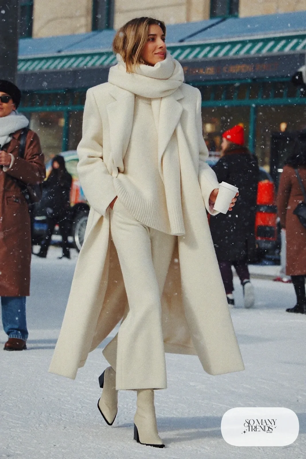 woman in ivory knit sweater, wide knit pants, long coat and boots outfit 31
