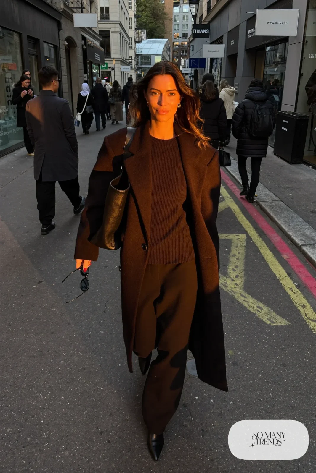 woman in black fine knit, wide-leg pants, long coat and leather boots outfit 32
