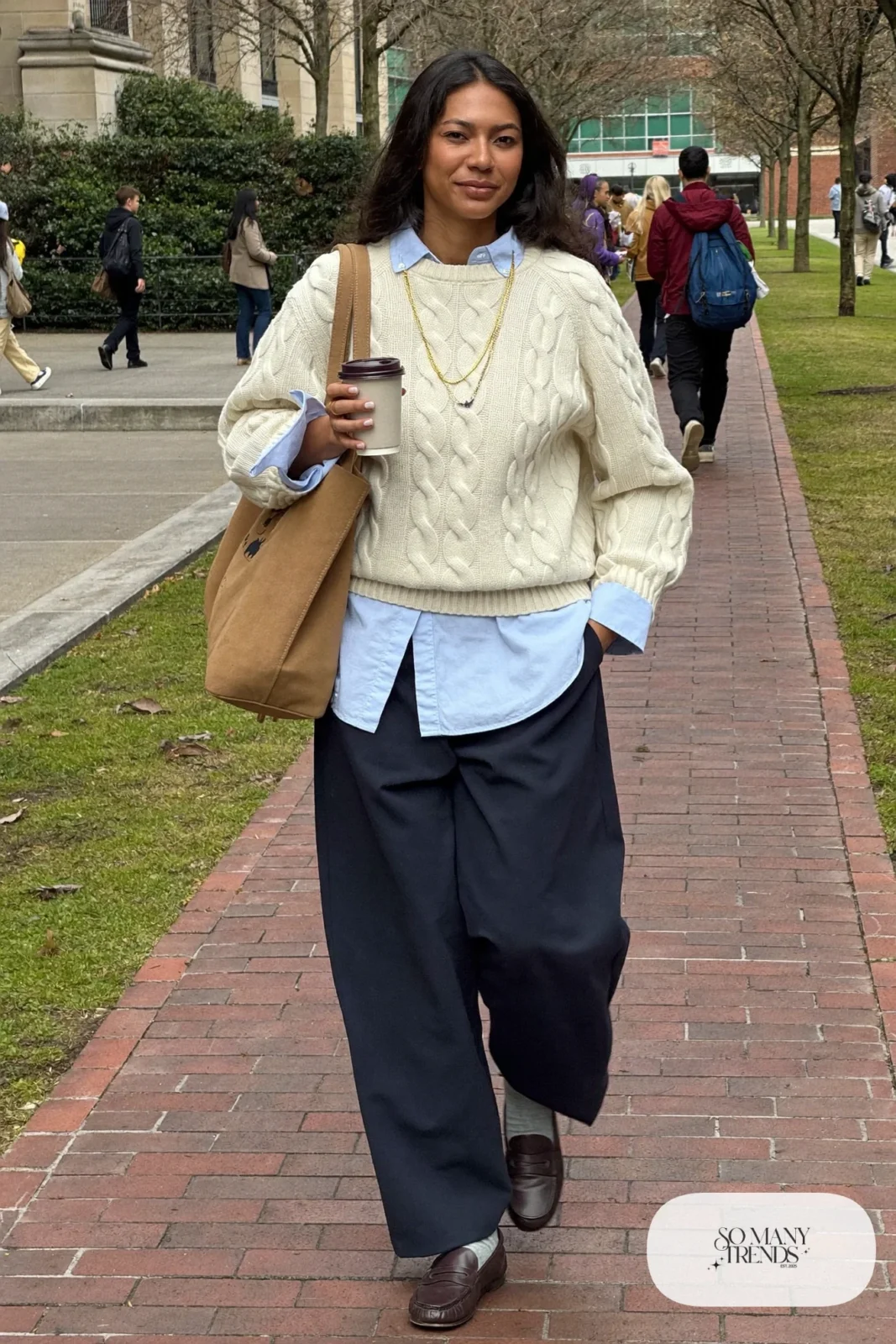 cream cable knit sweater over light blue oxford shirt, navy wide-leg pants, brown loafers, tote bag outfit 1