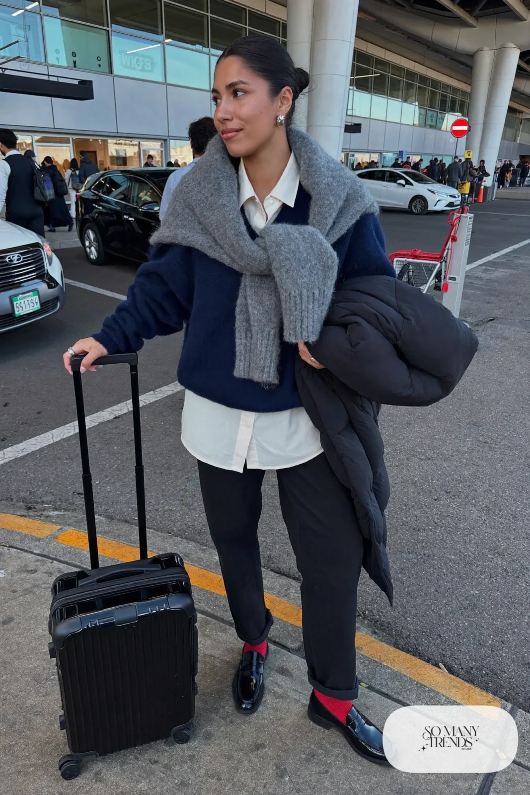 chunky gray sweater over white button-down shirt, black straight pants, red socks, black loafers outfit 5
