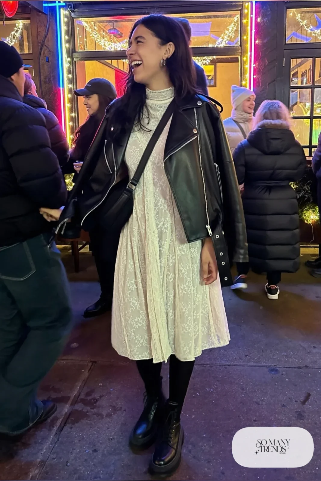 ivory long sleeve lace dress black cropped leather moto jacket black opaque tights lace up combat boots silver earrings outfit 6