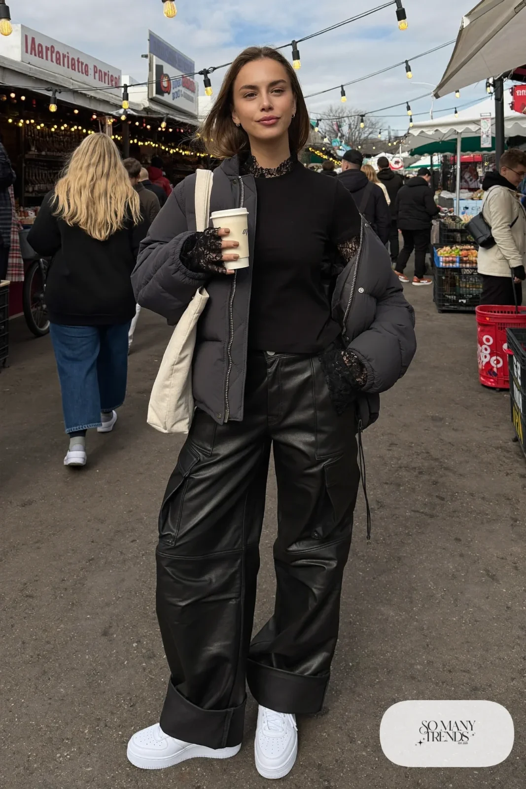 black lace sleeve tee black faux leather cargo pants charcoal puffer jacket white sneakers beanie tote bag outfit 20