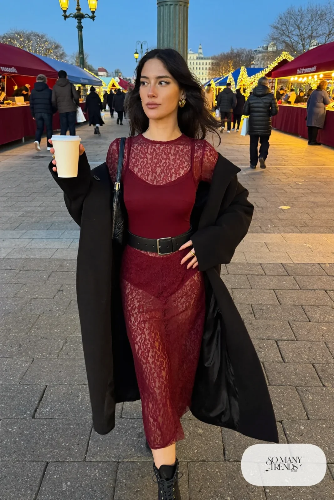 burgundy long sleeve lace midi dress wide black leather belt chunky black boots black coat gold hoops shoulder bag outfit 22