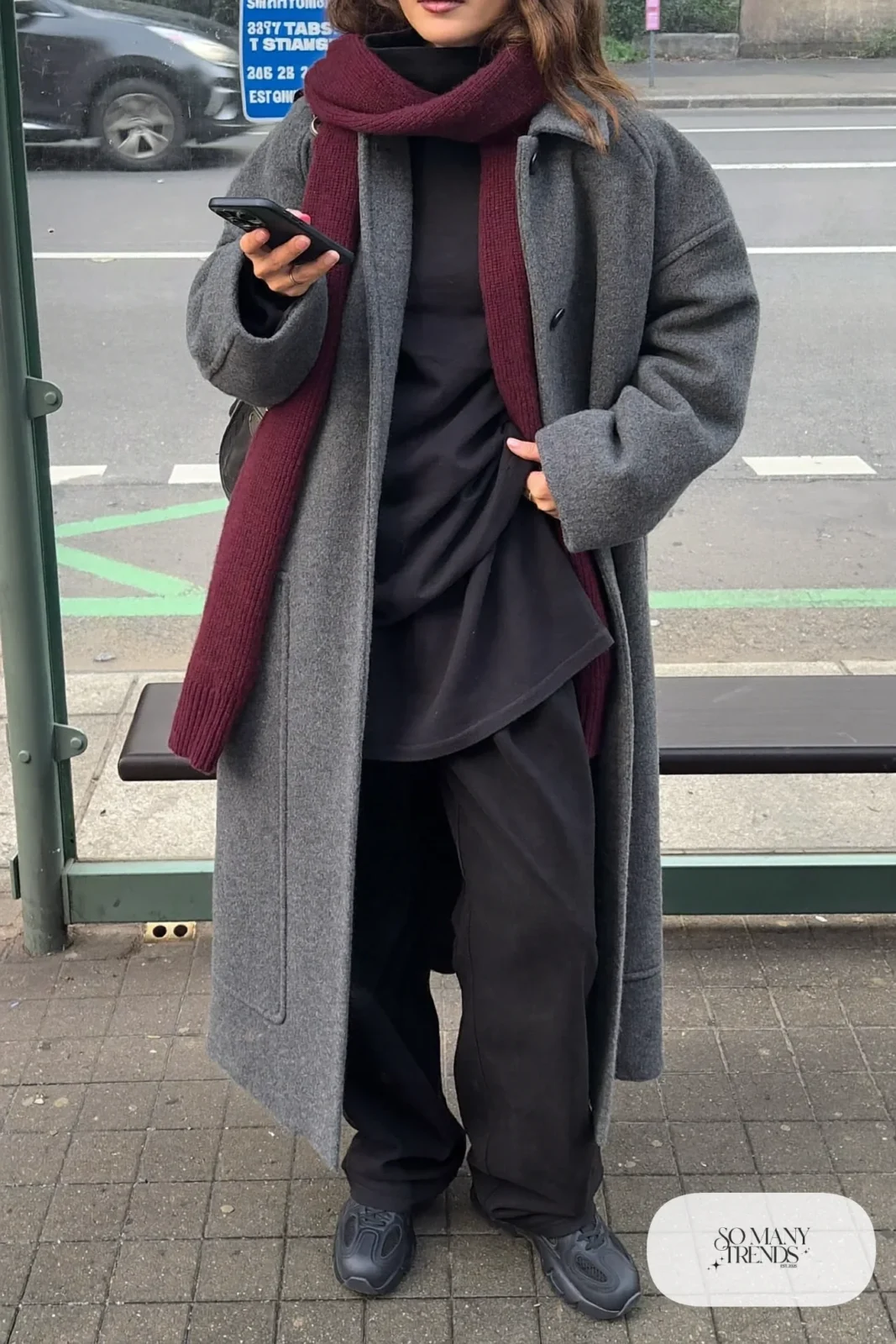 charcoal gray long wool coat burgundy wool scarf black turtleneck black wide-leg pants black chunky sneakers outfit 3