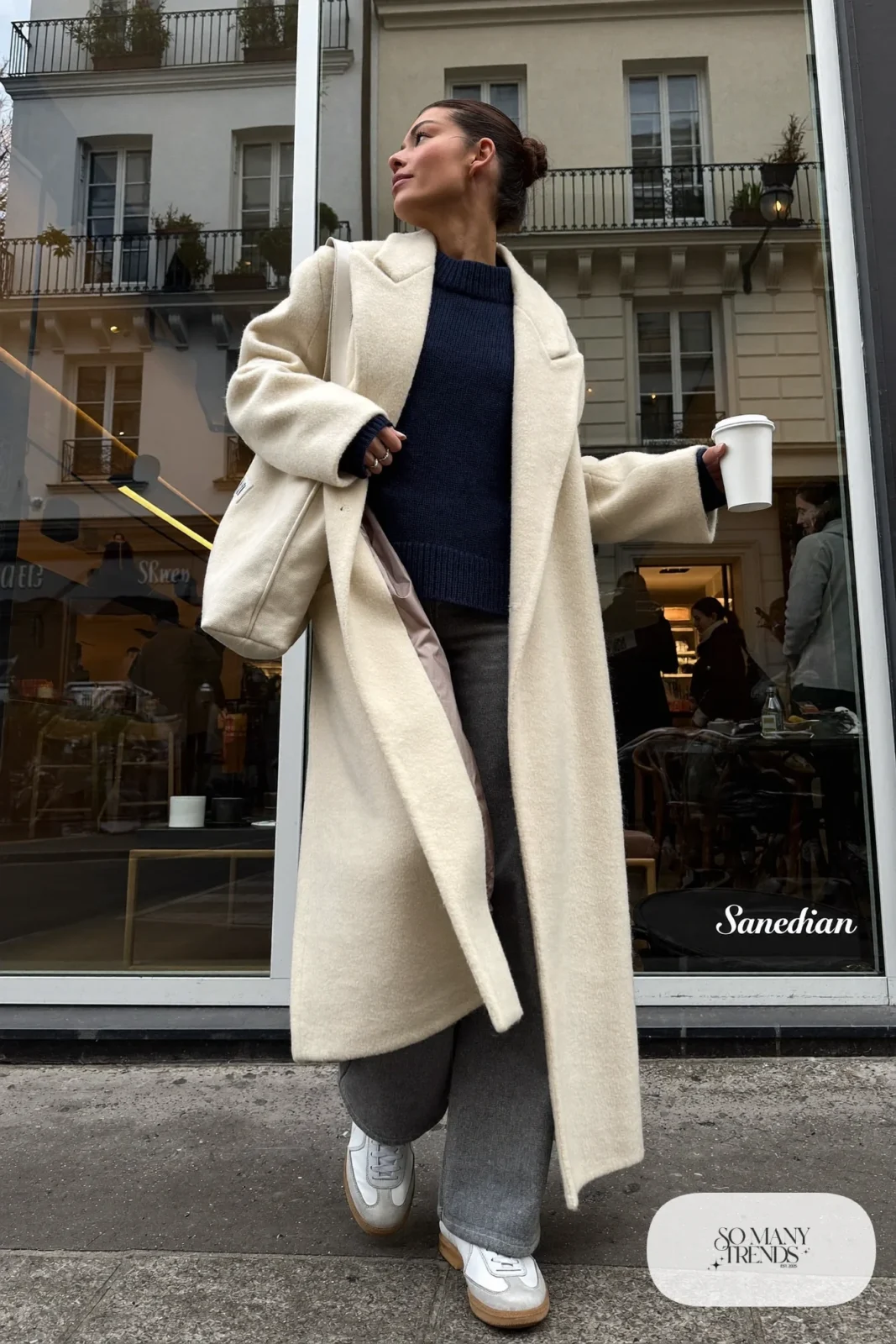 cream long wool coat navy knit sweater gray wide-leg pants white leather sneakers canvas tote outfit 12