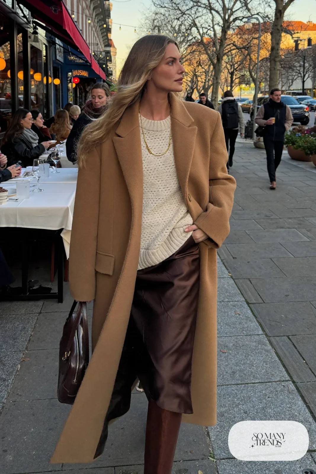 camel long coat chunky cream knit sweater chocolate satin midi skirt brown knee-high boots shoulder bag outfit 19