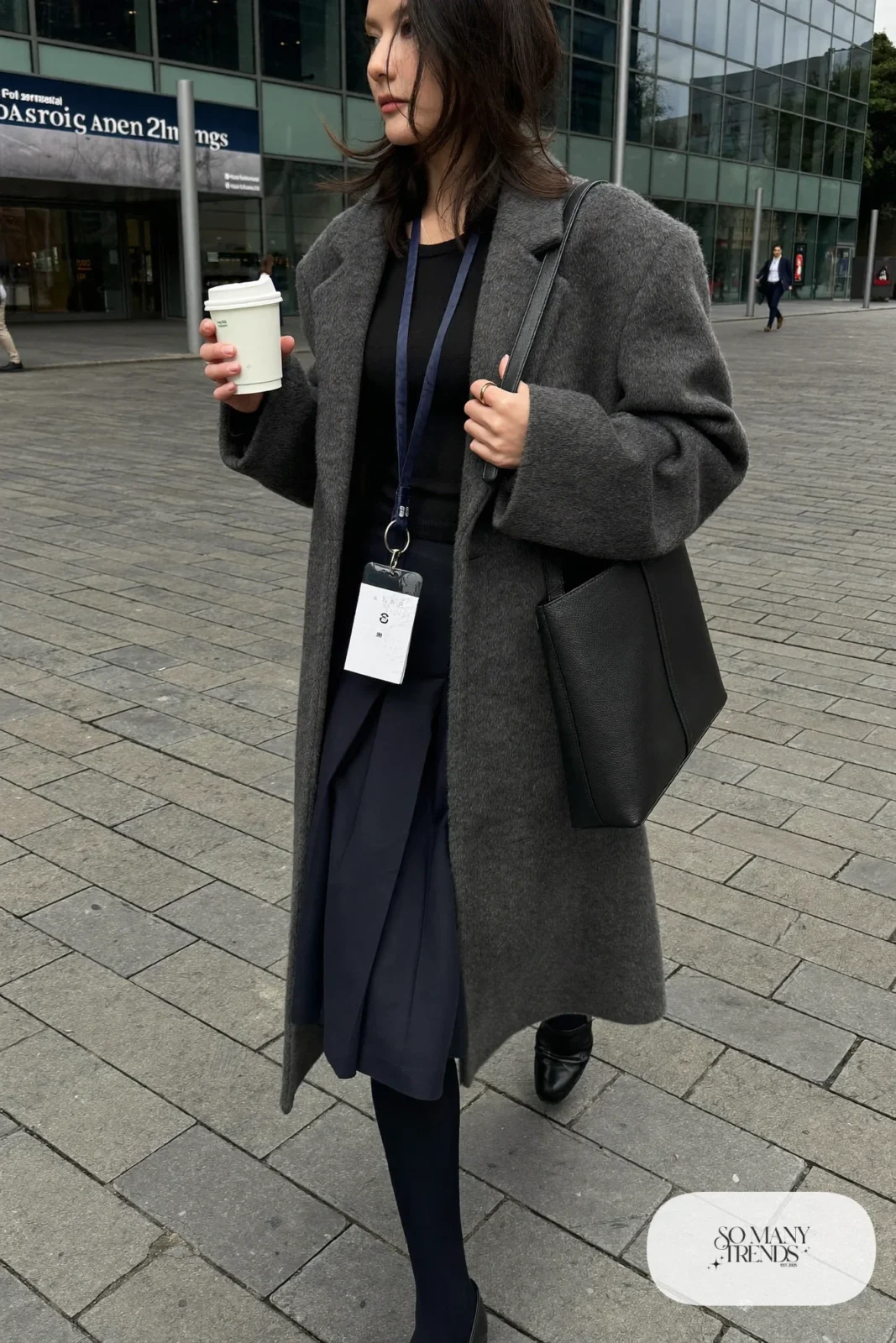 charcoal long coat navy pleated midi skirt black fitted sweater sheer tights black loafers shoulder bag outfit 20