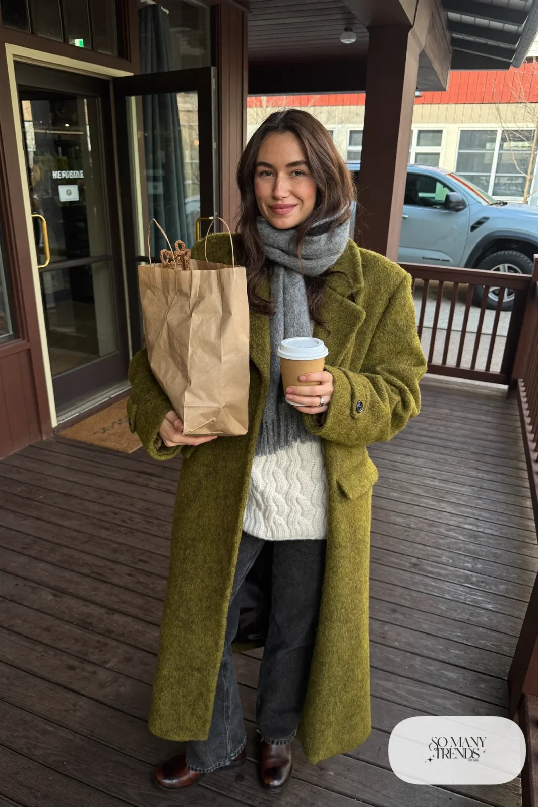olive green long coat cream cable knit sweater dark straight jeans brown leather boots wool scarf outfit 28
