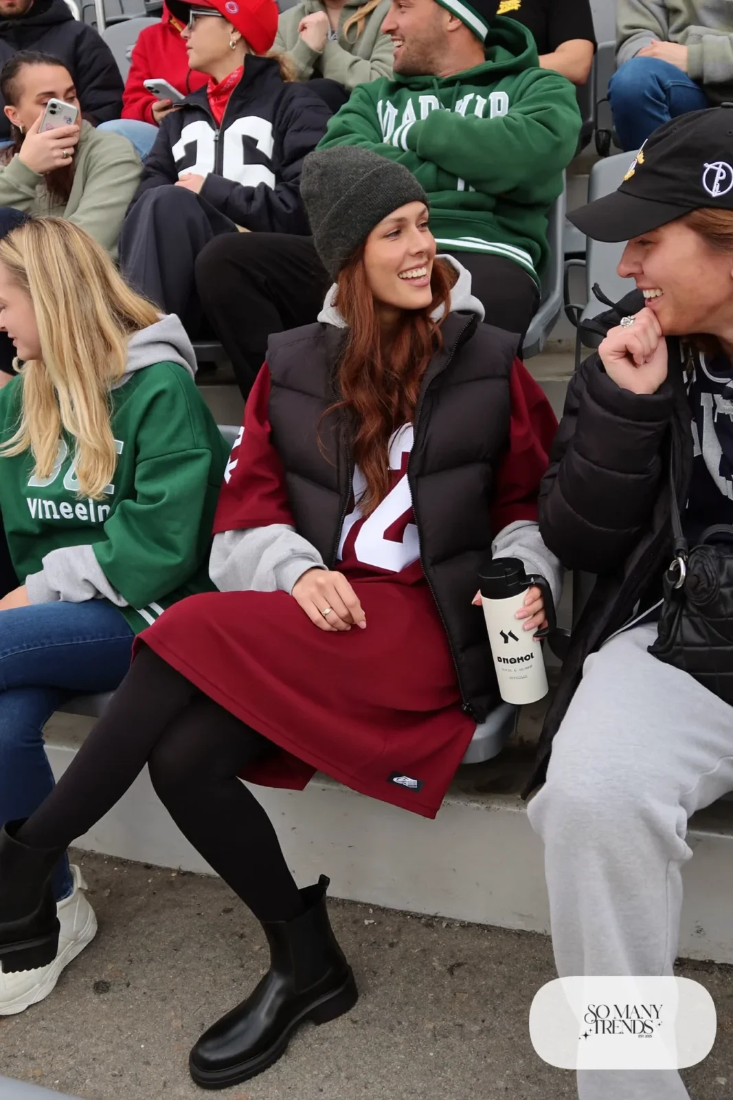 burgundy football jersey gray hoodie black puffer vest black leggings lug sole boots beanie outfit 3