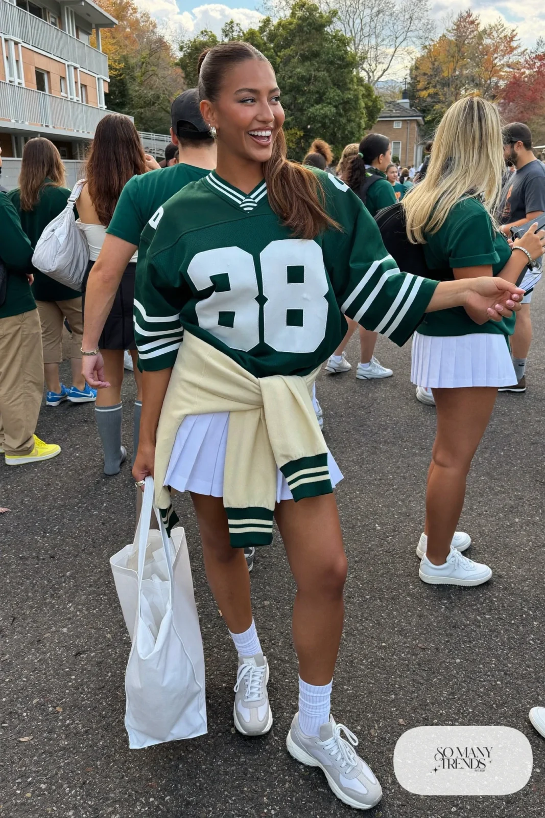 green football jersey white pleated tennis skirt varsity jacket white sneakers tall socks visor outfit 18