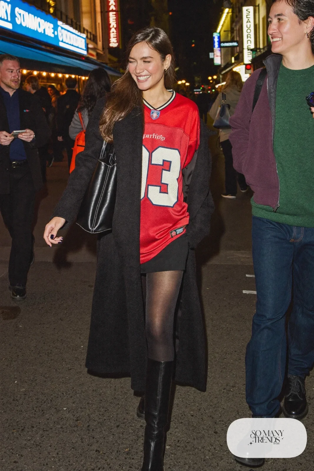 red football jersey black mini skirt opaque tights knee high boots long black coat tote outfit 25
