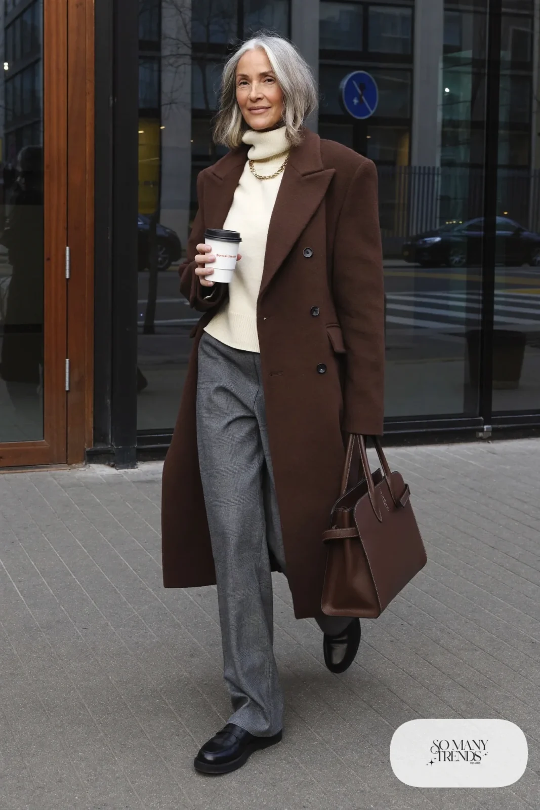 chocolate brown long wool coat gray wide-leg flannel pants cream turtleneck black loafers brown leather tote business casual outfit 1