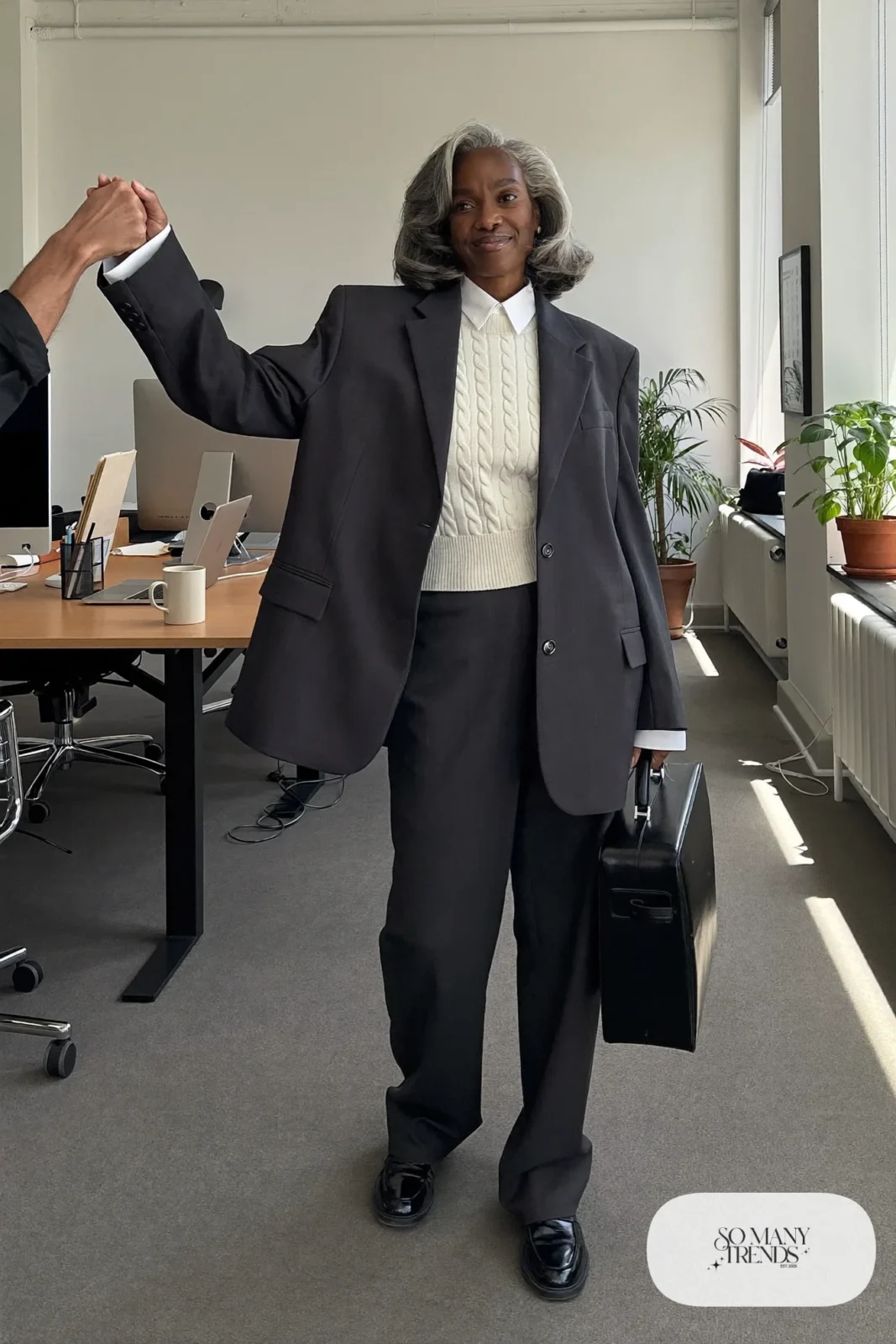 charcoal gray oversized blazer matching straight pants cream knit vest white shirt black loafers briefcase office outfit 5