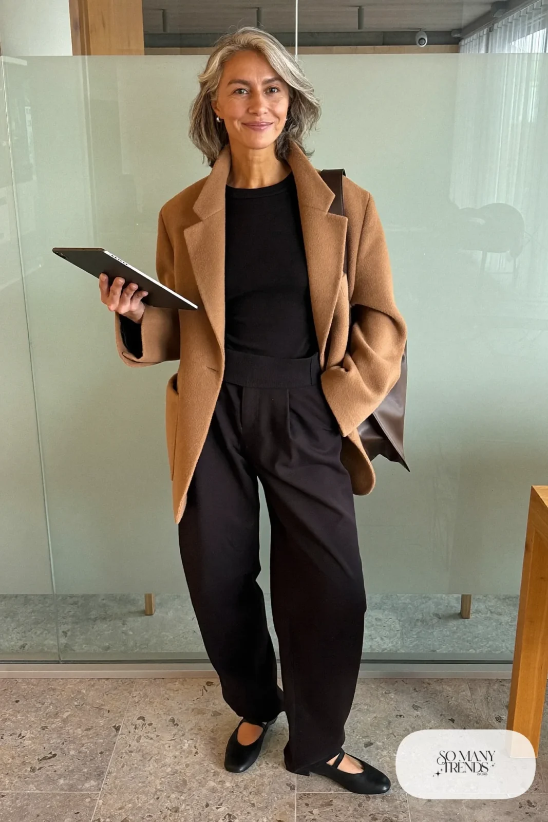 camel oversized blazer black barrel-leg pants black fine knit top black mary jane flats leather bag office outfit 9