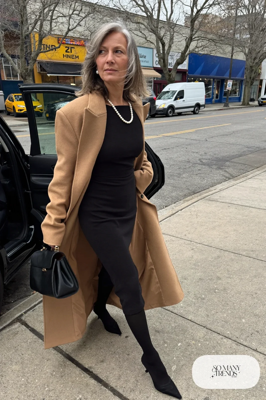 black knit sheath midi dress long camel cardigan coat sheer black tights low black pumps leather bag pearl necklace office outfit 23