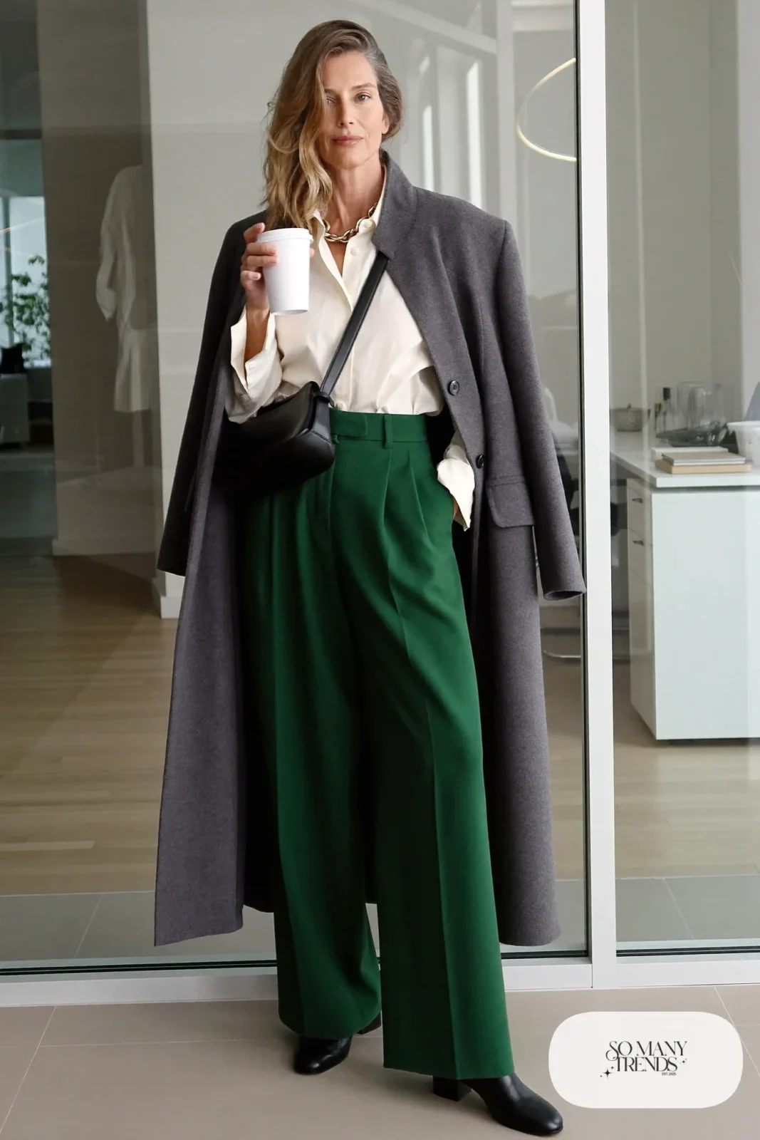 forest green wide-leg pants cream poplin shirt long gray coat black ankle boots black leather bag gold necklace office outfit 24