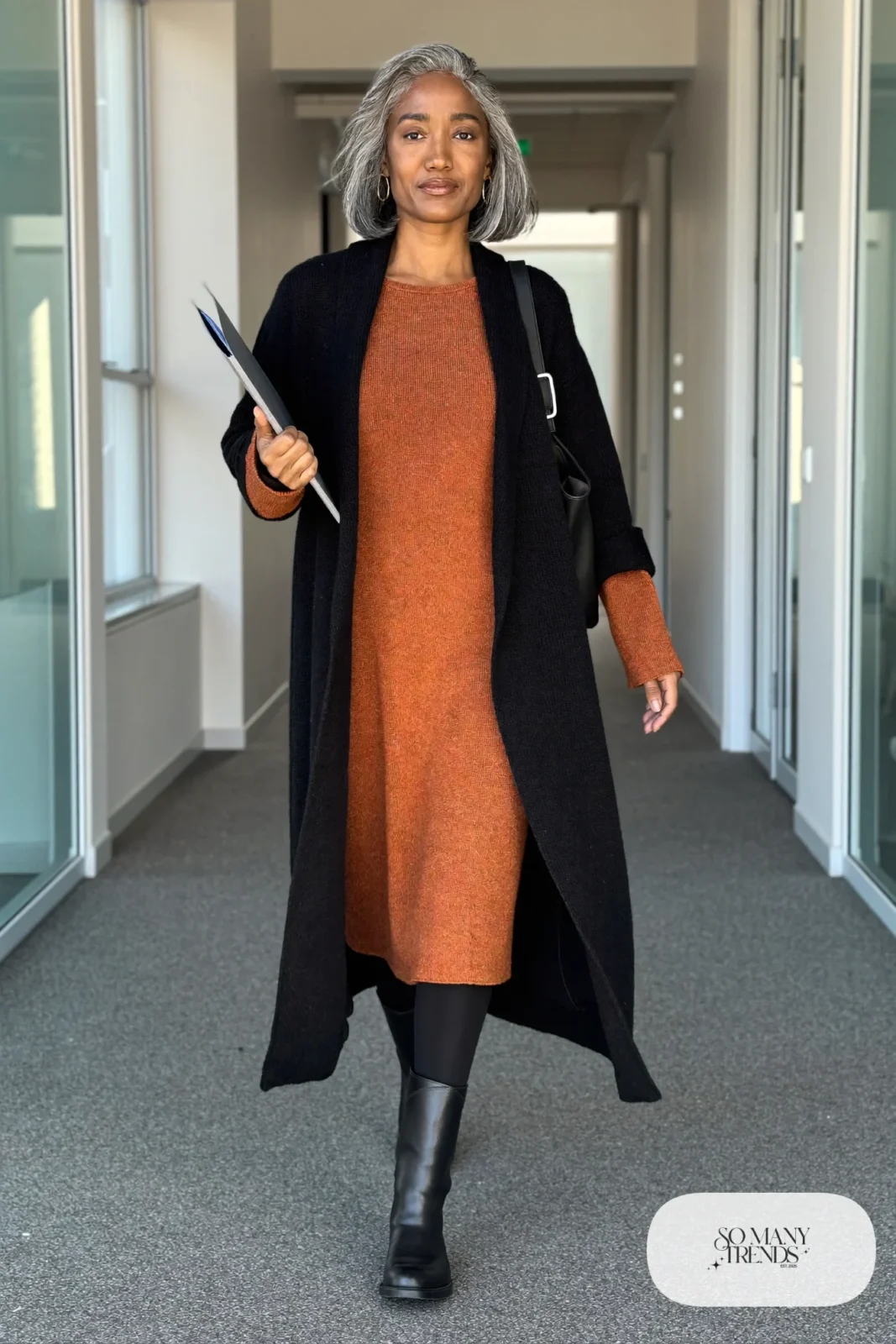 rust knit midi dress long black cardigan black opaque tights black boots black leather bag gold earrings office outfit 27
