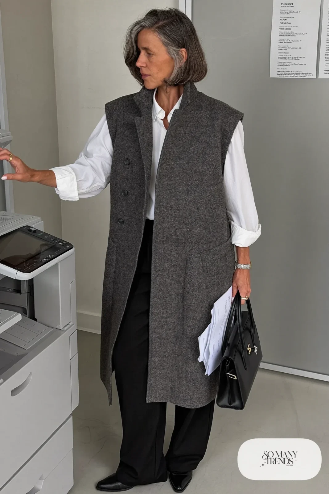 long gray flannel vest white crisp shirt black wide-leg pants black pointed loafers leather bag gold ring office outfit 30