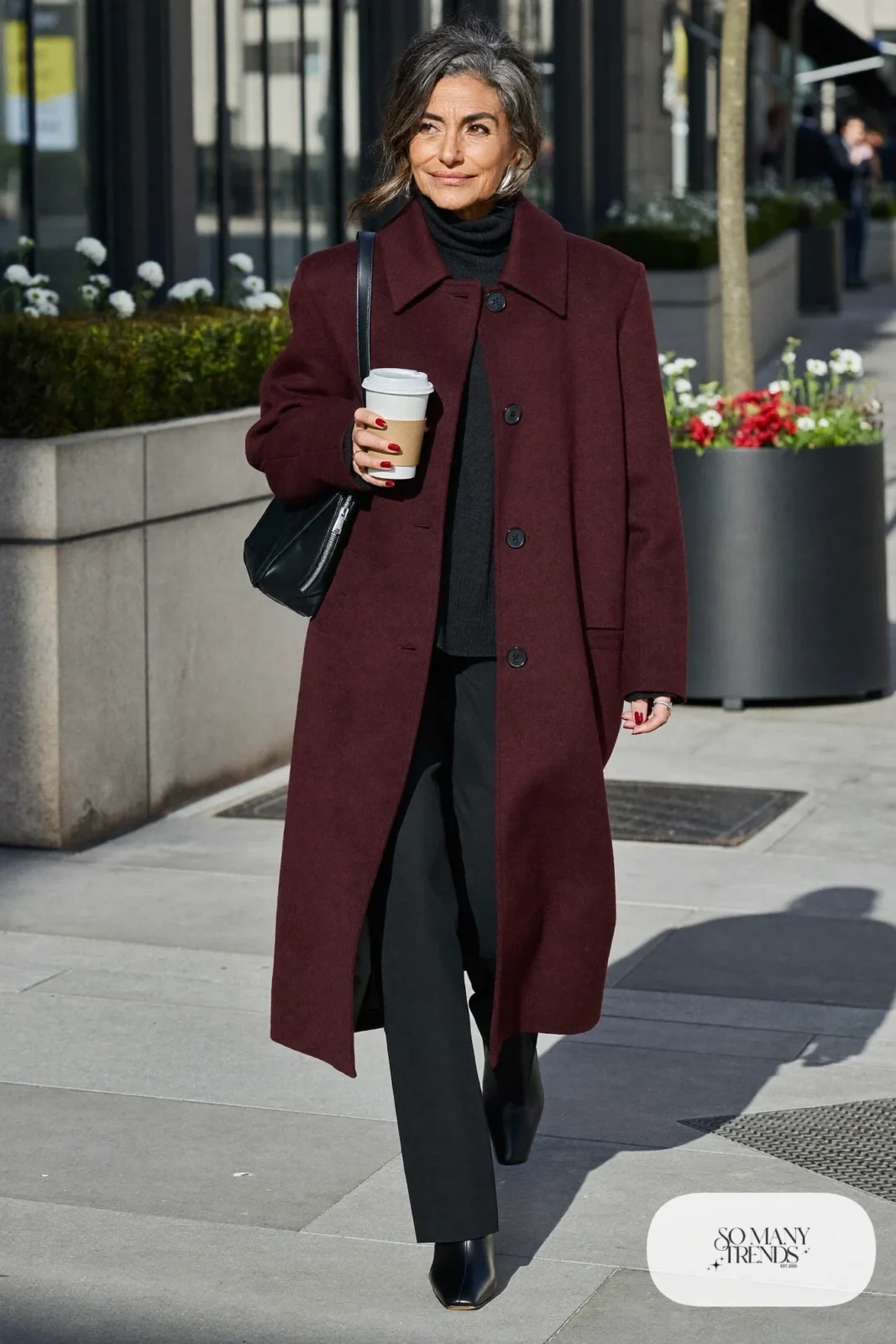 long burgundy wool coat black turtleneck black straight pants black ankle boots black leather bag silver earrings office outfit 31