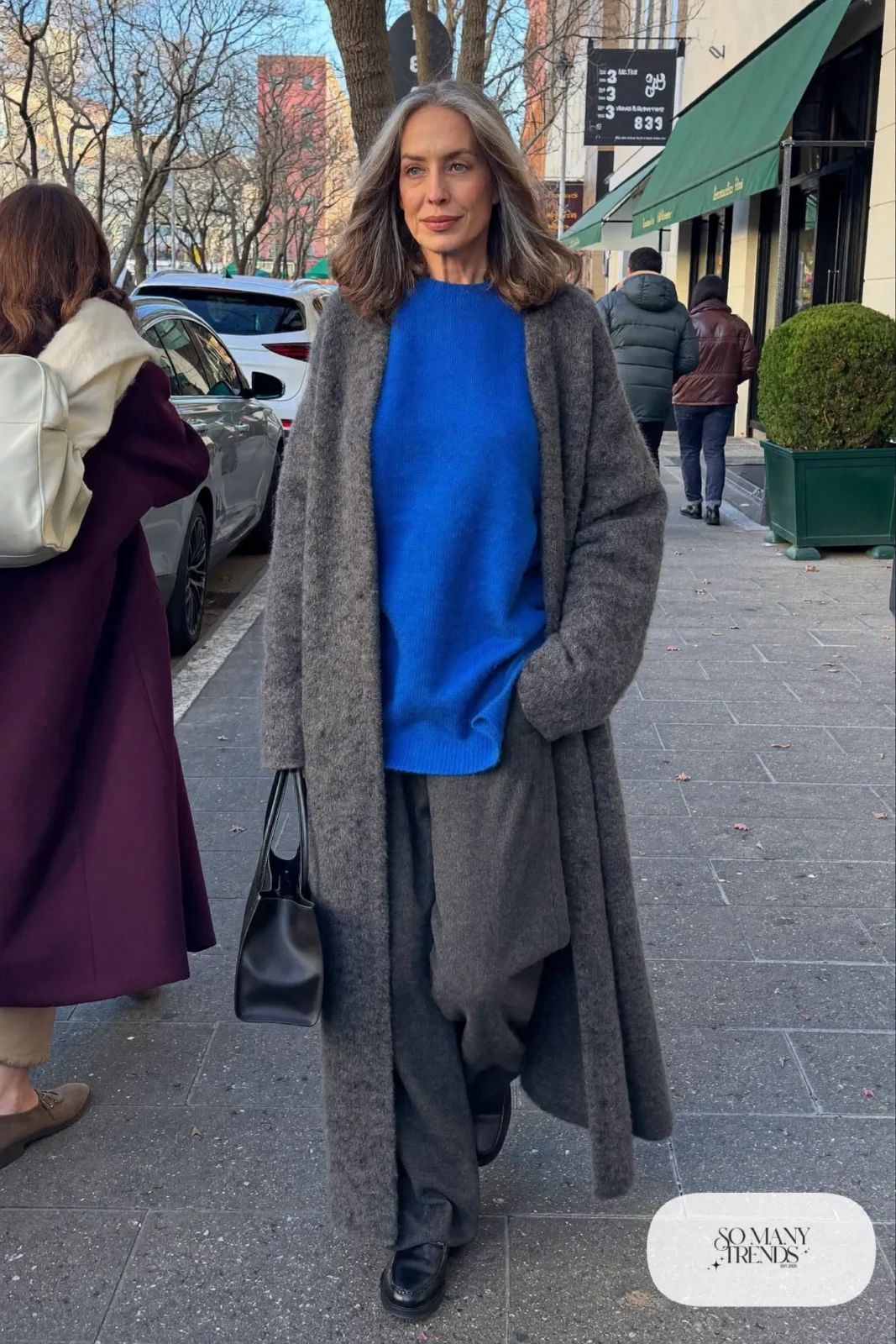 woman over 60 in charcoal wool pants cobalt blue knit sweater long gray cardigan black loafers outfit 15
