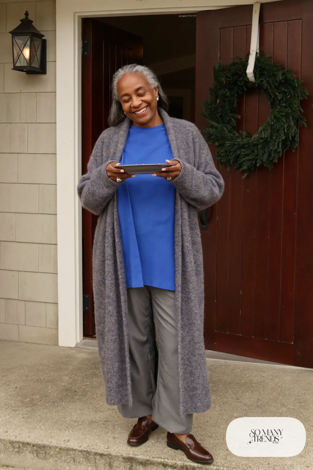 woman over 60 in long gray cardigan cobalt blue blouse gray pants leather loafers outfit 22