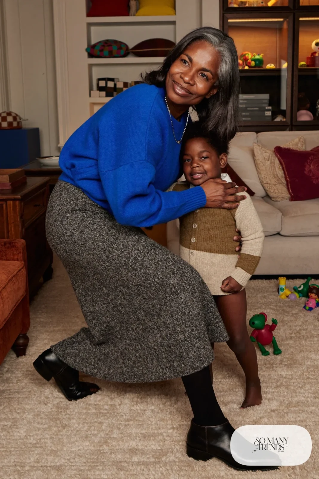 woman over 60 in cobalt blue sweater long gray knit skirt opaque tights low boots silver necklace outfit 25