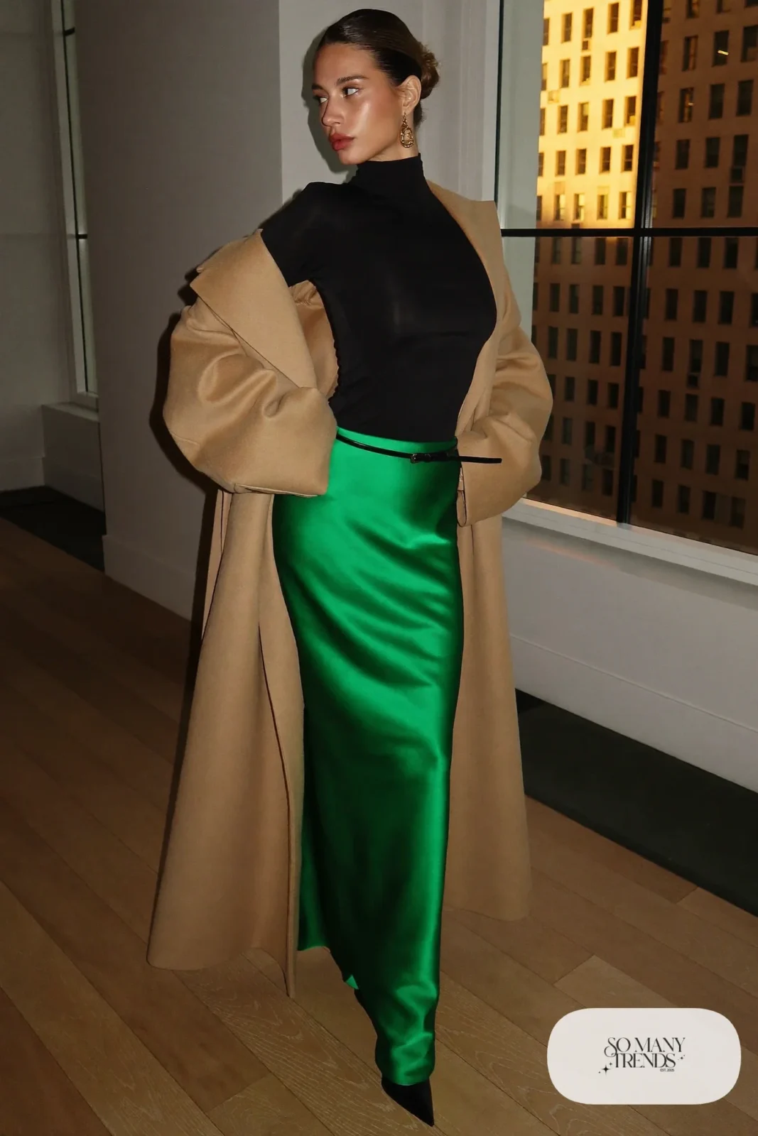 black long sleeve bodysuit emerald satin maxi skirt black pointed boots camel coat gold earrings outfit 11