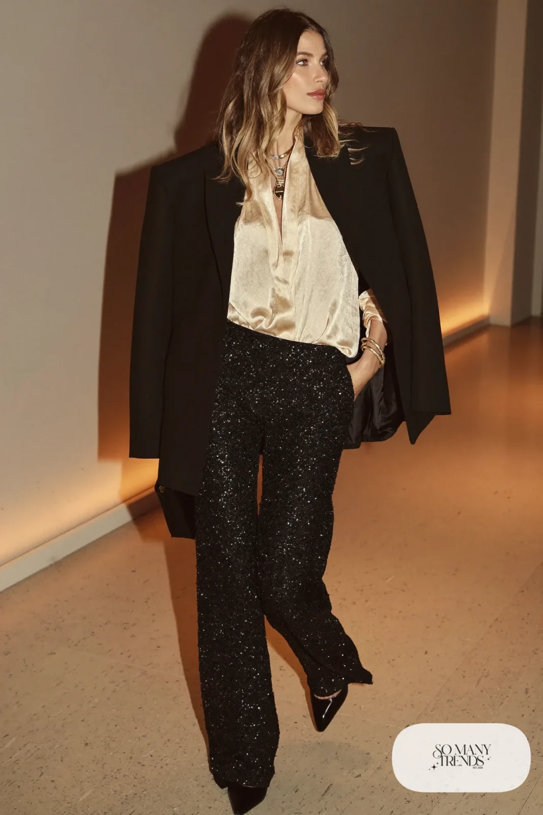 black sequin wide leg pants cream silk blouse black blazer black pointed pumps gold jewelry outfit 28
