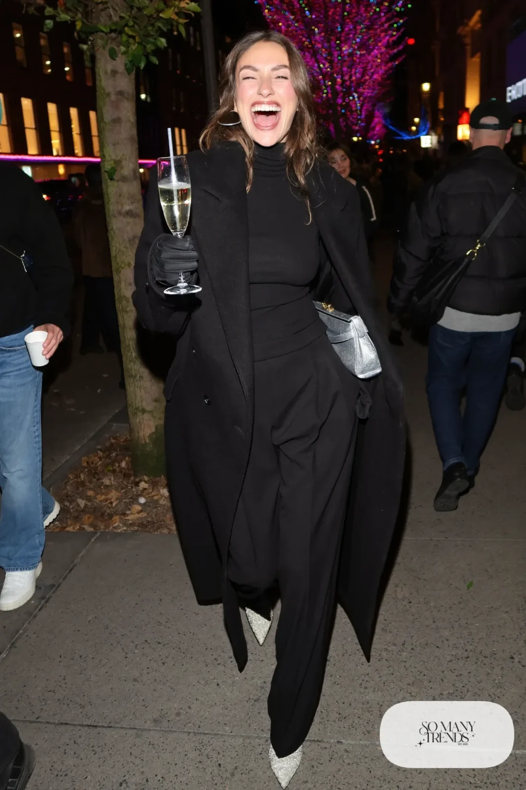 black turtleneck black wide-leg pants long black coat glitter silver ankle boots metallic bag outfit 27