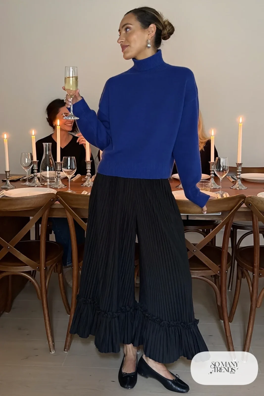 cobalt blue merino turtleneck black pleated wide-leg pants black ballet flats silver earrings outfit 10