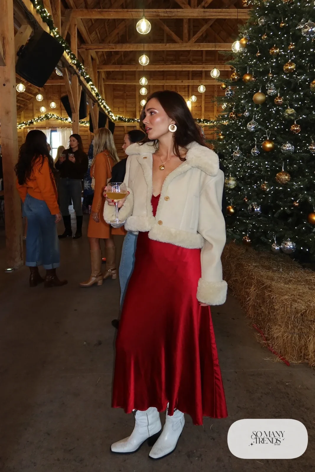 red satin midi dress white cowboy boots cropped shearling jacket gold hoop earrings outfit 7
