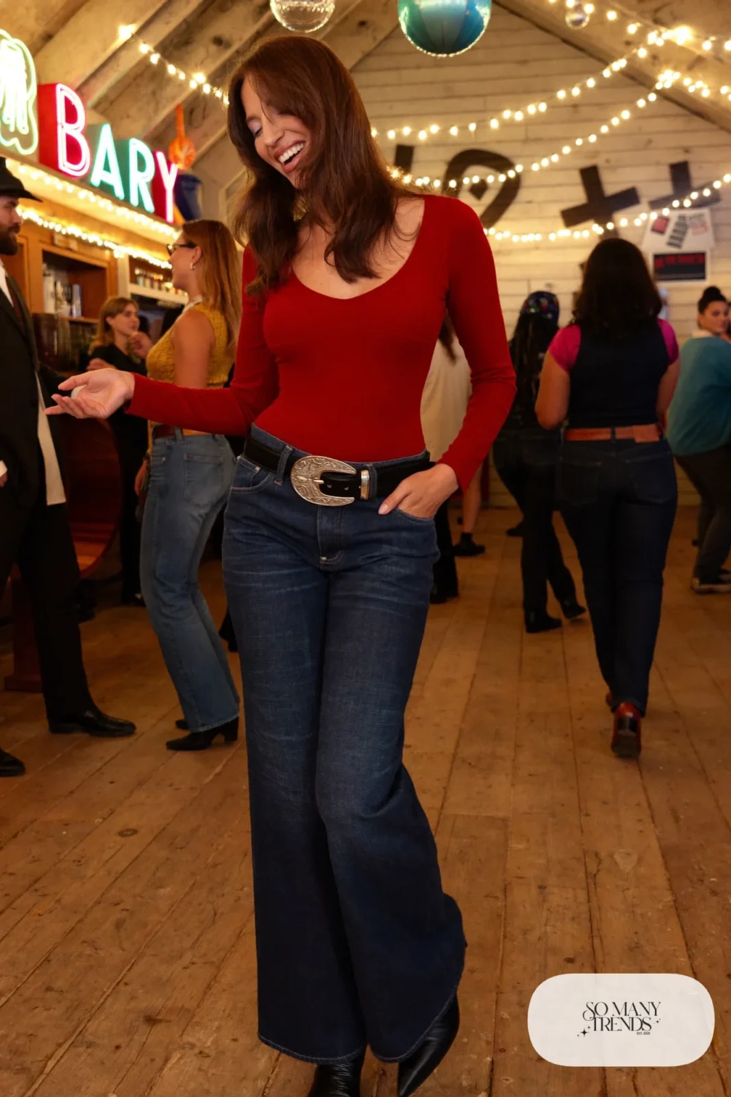 high rise wide-leg dark jeans red long sleeve bodysuit big belt buckle black cowboy boots outfit 14