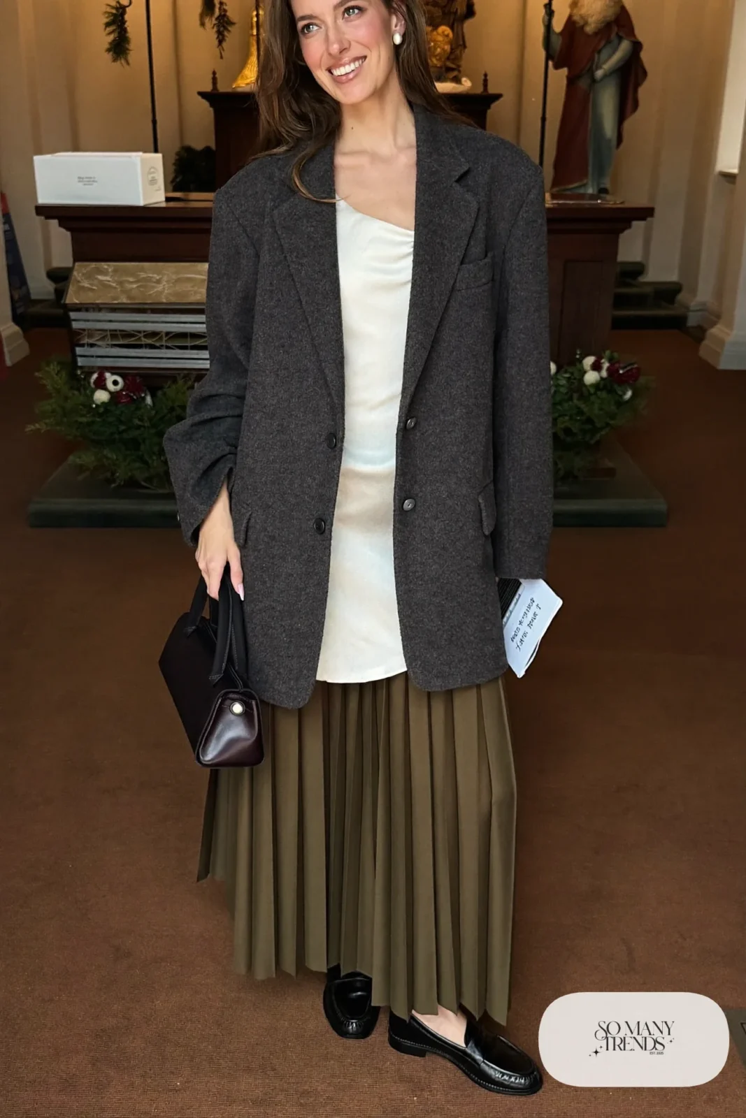 olive satin pleated midi skirt oversized charcoal blazer white silk top black loafers outfit 14
