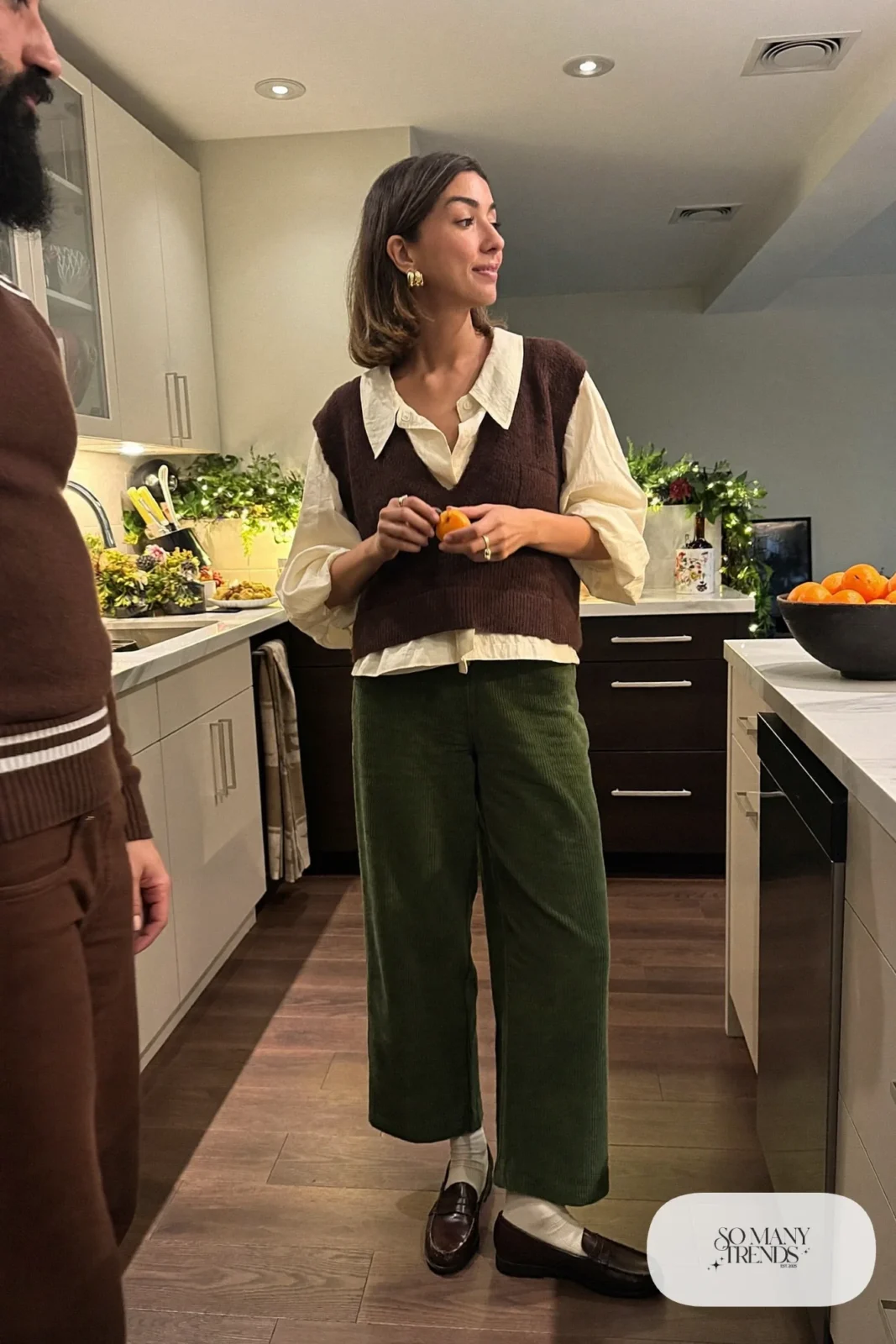 olive corduroy wide-leg pants cream blouse brown knit vest brown loafers outfit 28