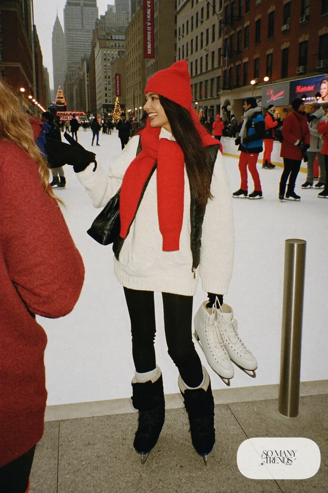 black fleece-lined leggings oversized cream knit sweater quilted black vest wool socks winter boots beanie outfit 7