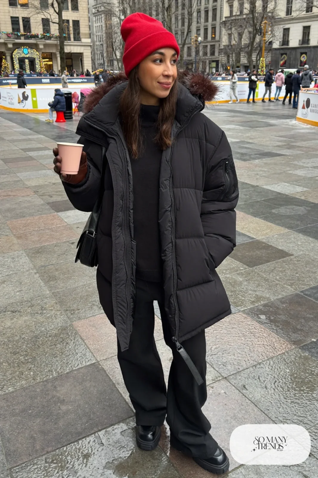 black hooded parka red knit beanie black turtleneck black pants black lug-sole boots brown leather gloves outfit 12