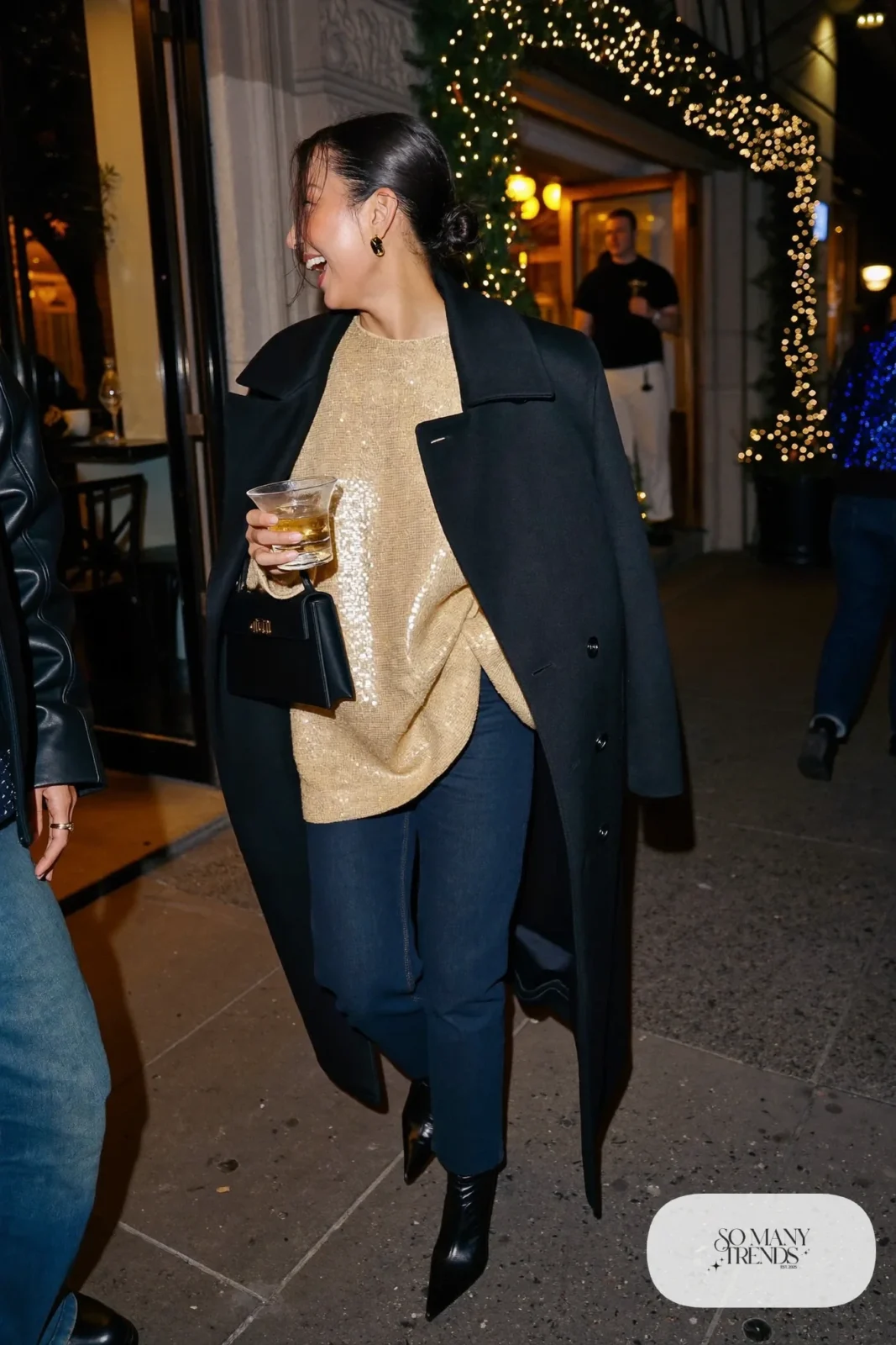 loose champagne sequin top dark straight jeans long black wool coat black pointed ankle boots small gold earrings outfit 25