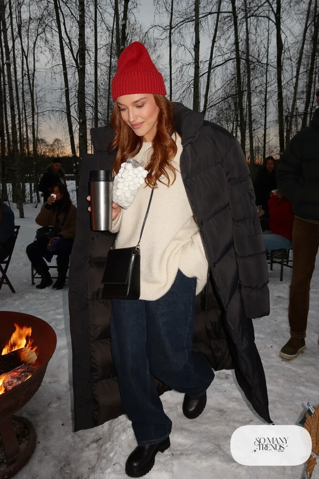 long black puffer coat chunky knit sweater straight jeans cranberry beanie lug-sole boots crossbody bag holiday outfit 33
