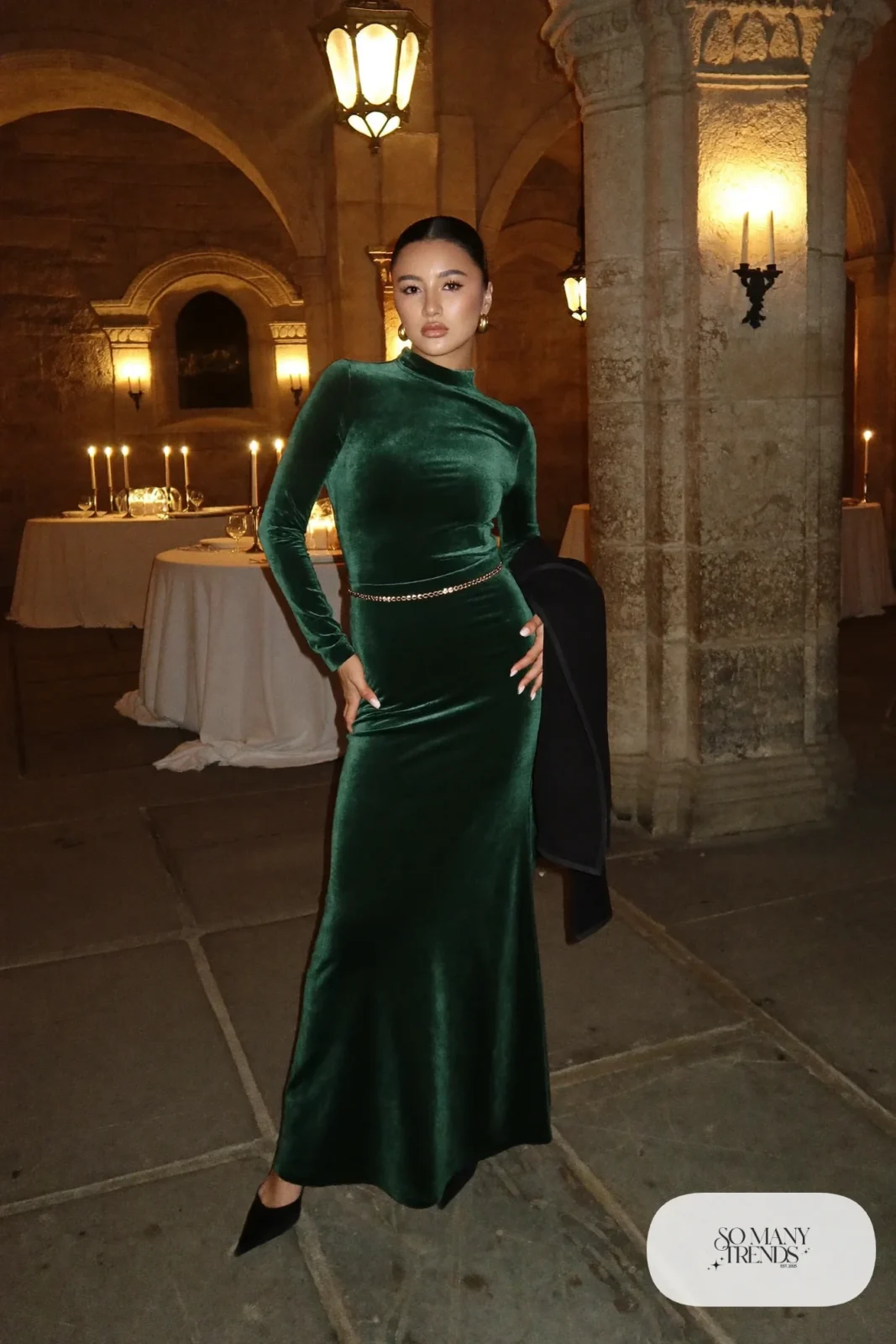forest green velvet long-sleeve top and floor-length skirt set with gold belt and black heels, formal winter outfit 6