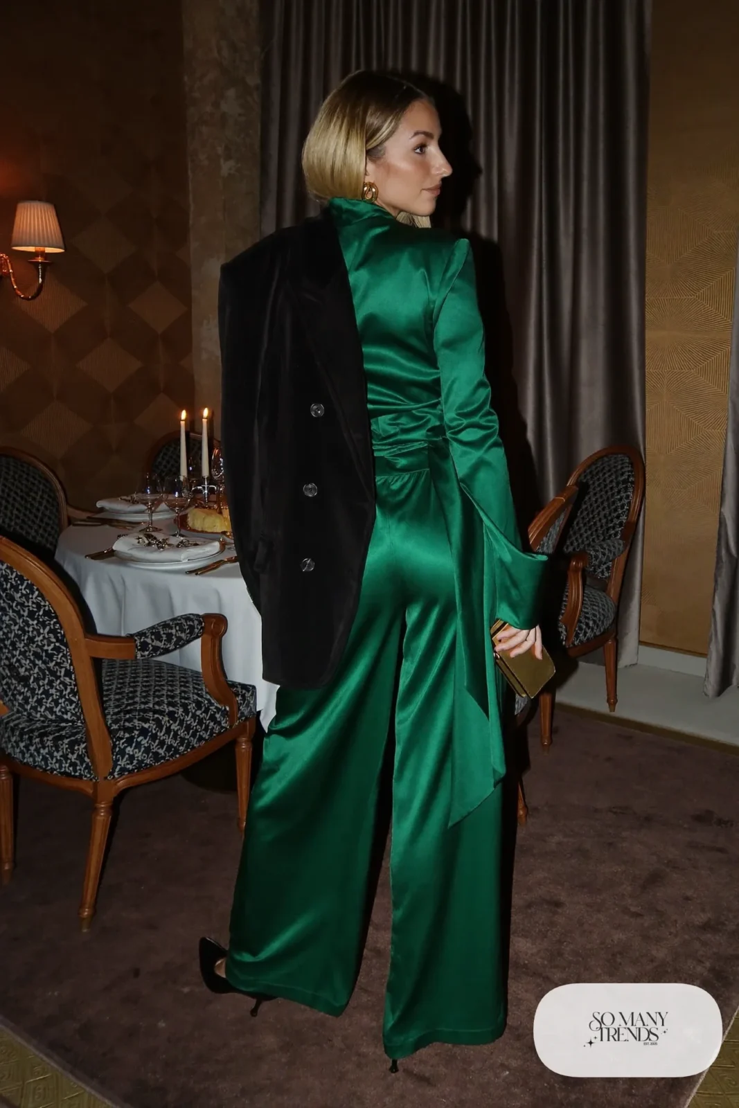 emerald green satin wrap top and wide-leg pants with black velvet blazer, gold earrings and black heels, formal winter outfit 16