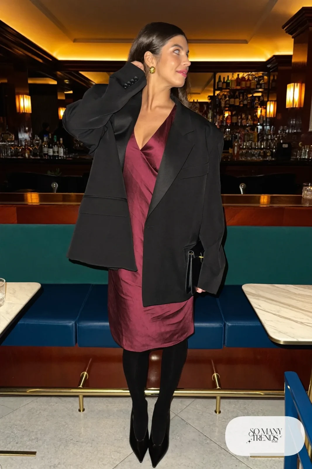 burgundy satin knee-length cocktail dress with oversized black blazer, sheer tights and black pumps, formal winter outfit 22